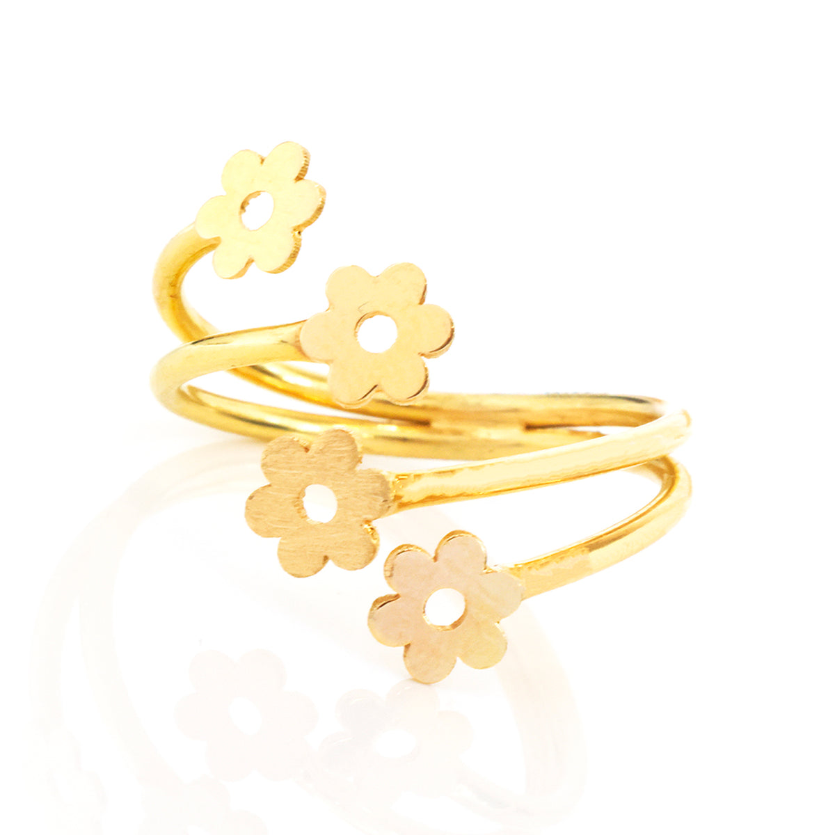 A gold-plated open wrap ring featuring four small flower-shaped charms, displayed on a clean white background with a soft reflection.