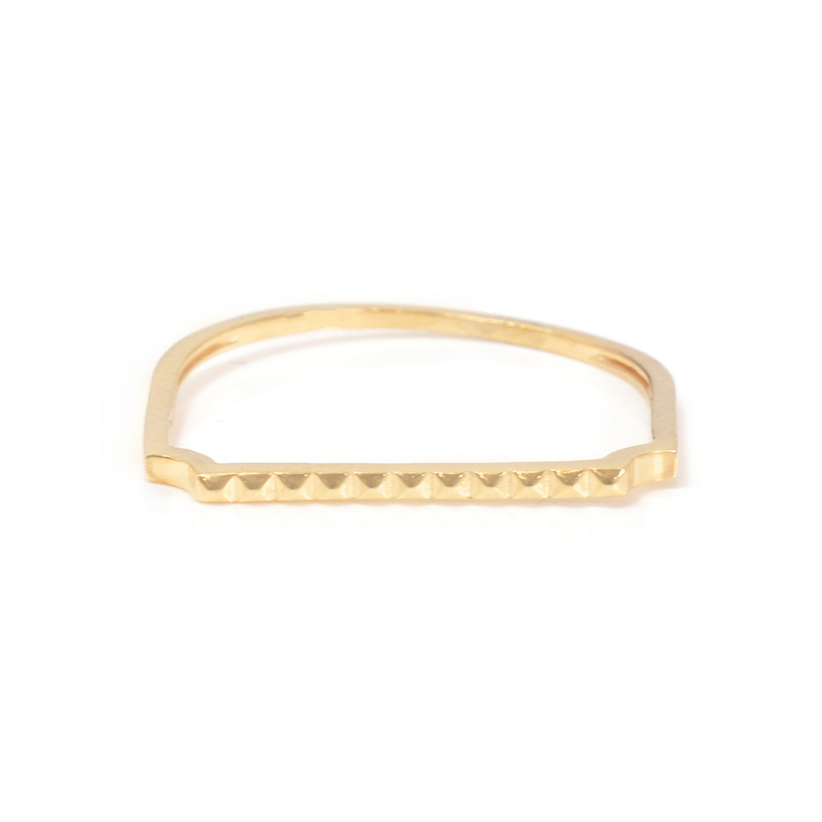 A gold-toned metal ring with a textured, beaded outer edge and a smooth inner band, shown on a plain white background.