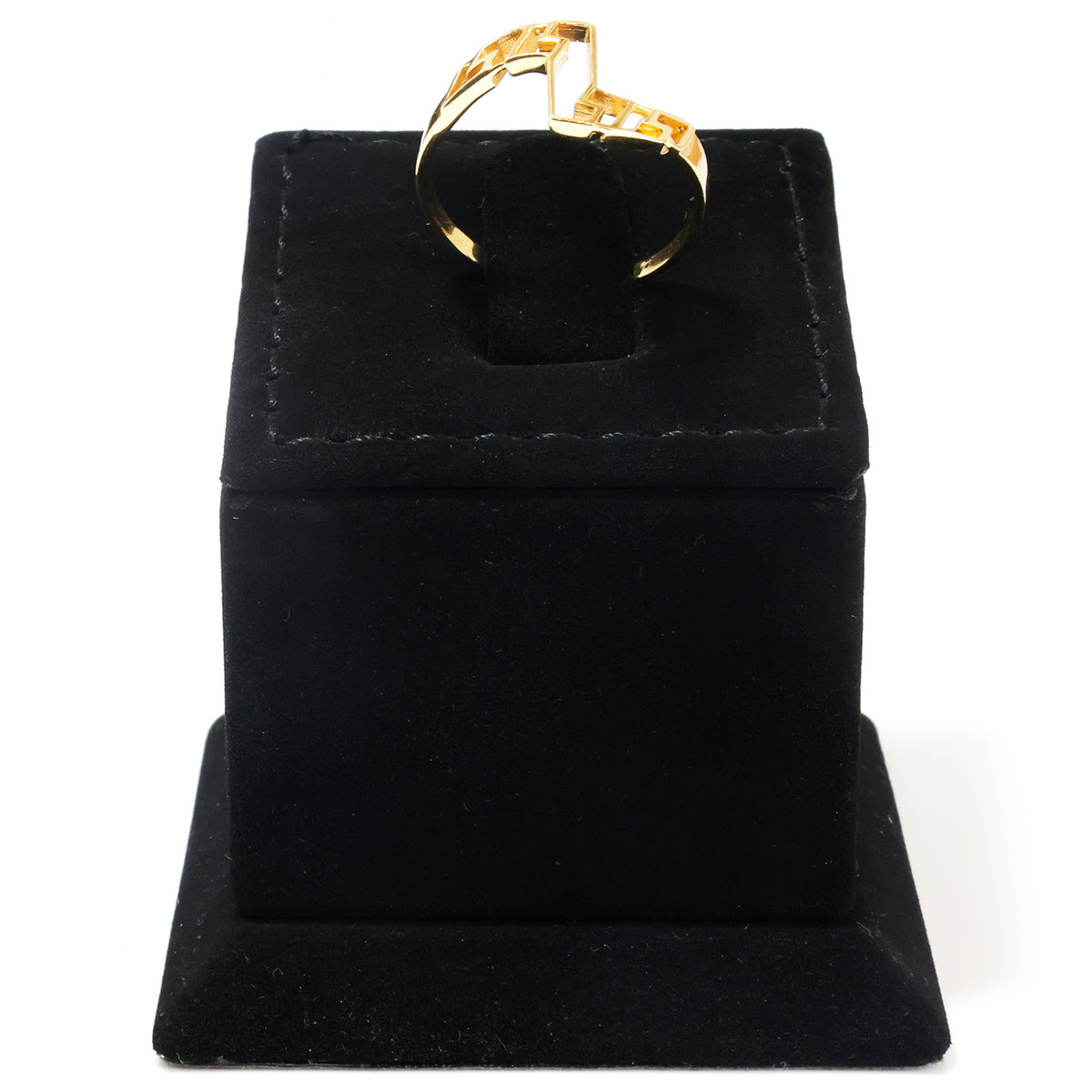 A gold ring displayed on a black velvet ring box against a white background.