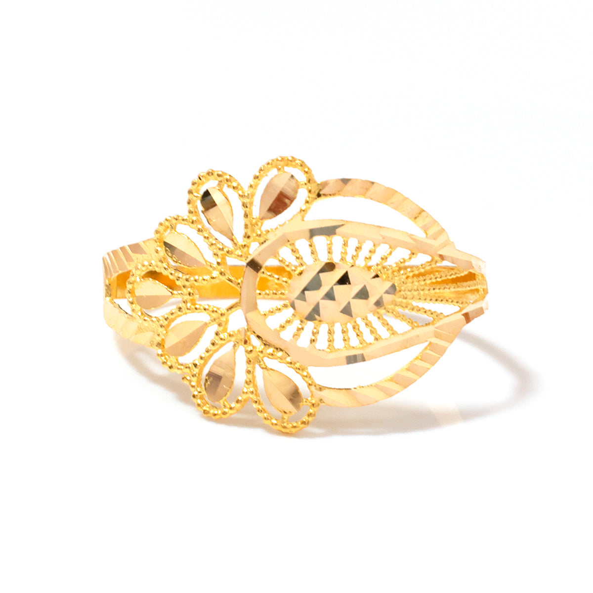 A gold-colored filigree cuff bracelet with intricate openwork patterns, teardrop-shaped cutouts, and a textured central diamond motif, shown on a plain white background.