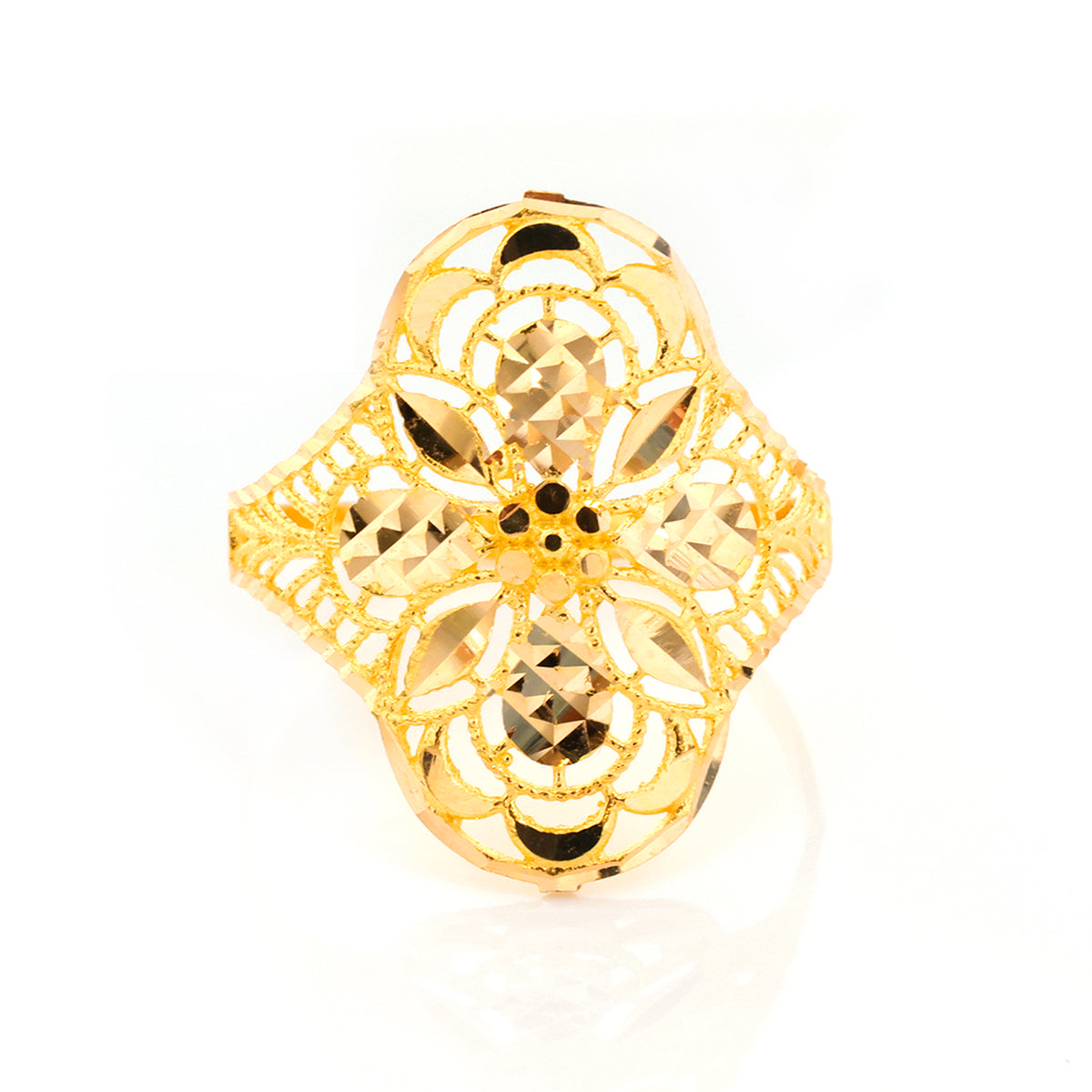 A gold filigree ring with a four-petal floral design and faceted cutout details, shown on a clean white background.