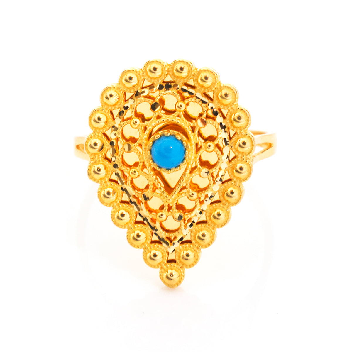 A gold teardrop-shaped ring with intricate filigree detailing and a central round blue stone, shown on a plain white background.