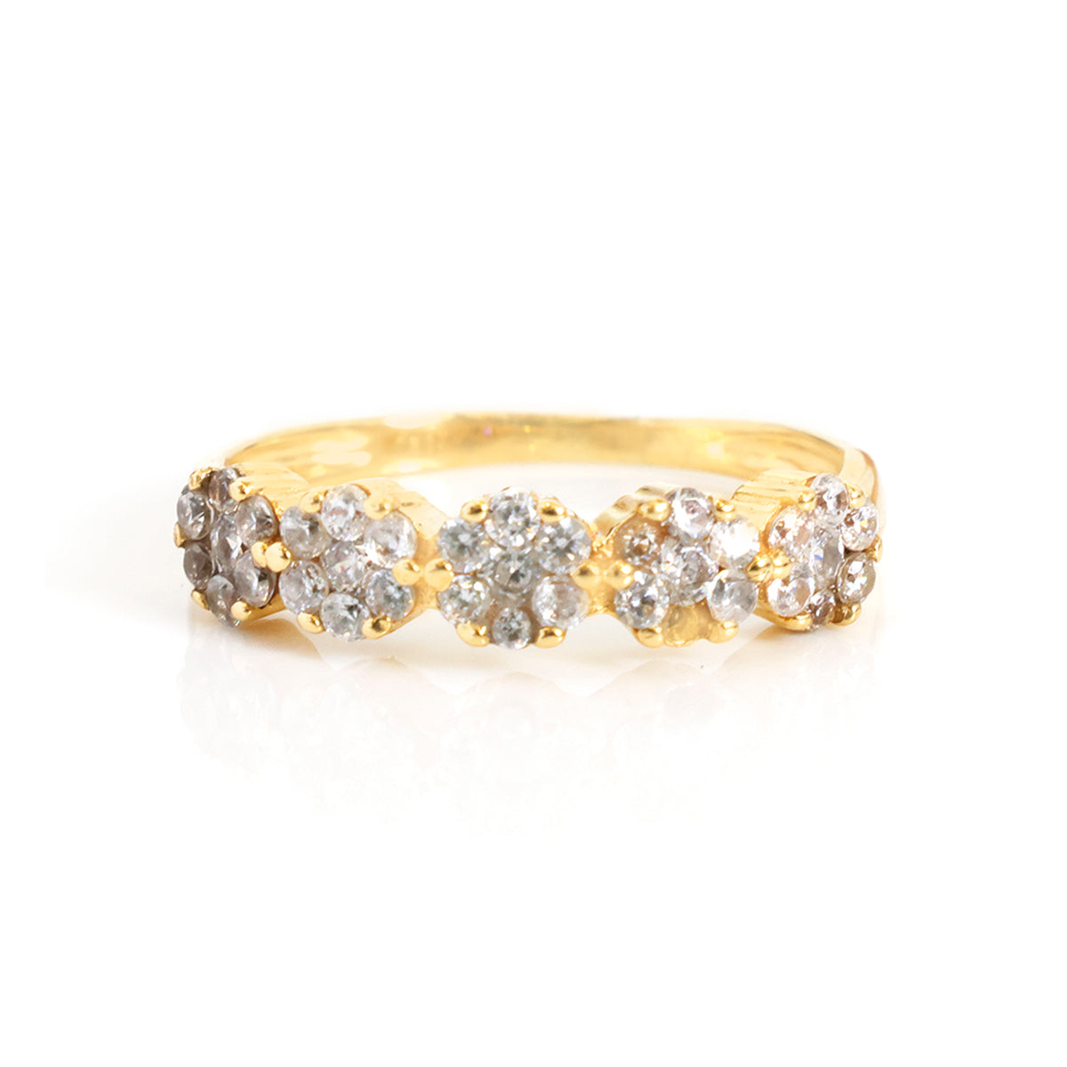 A yellow gold ring featuring five round diamond flower clusters set across the band, photographed on a clean white background.
