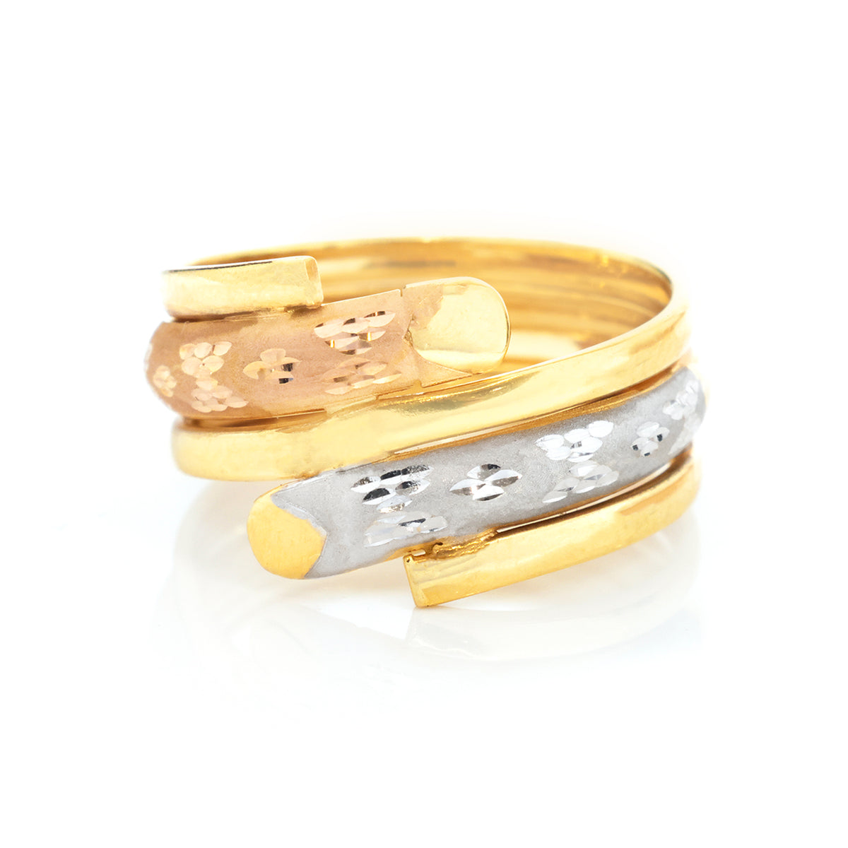 A multi-band wrap ring featuring three distinct bands: a polished yellow gold band, a textured rose gold band, and a textured silver band, all with small floral cutouts, set against a clean white background.