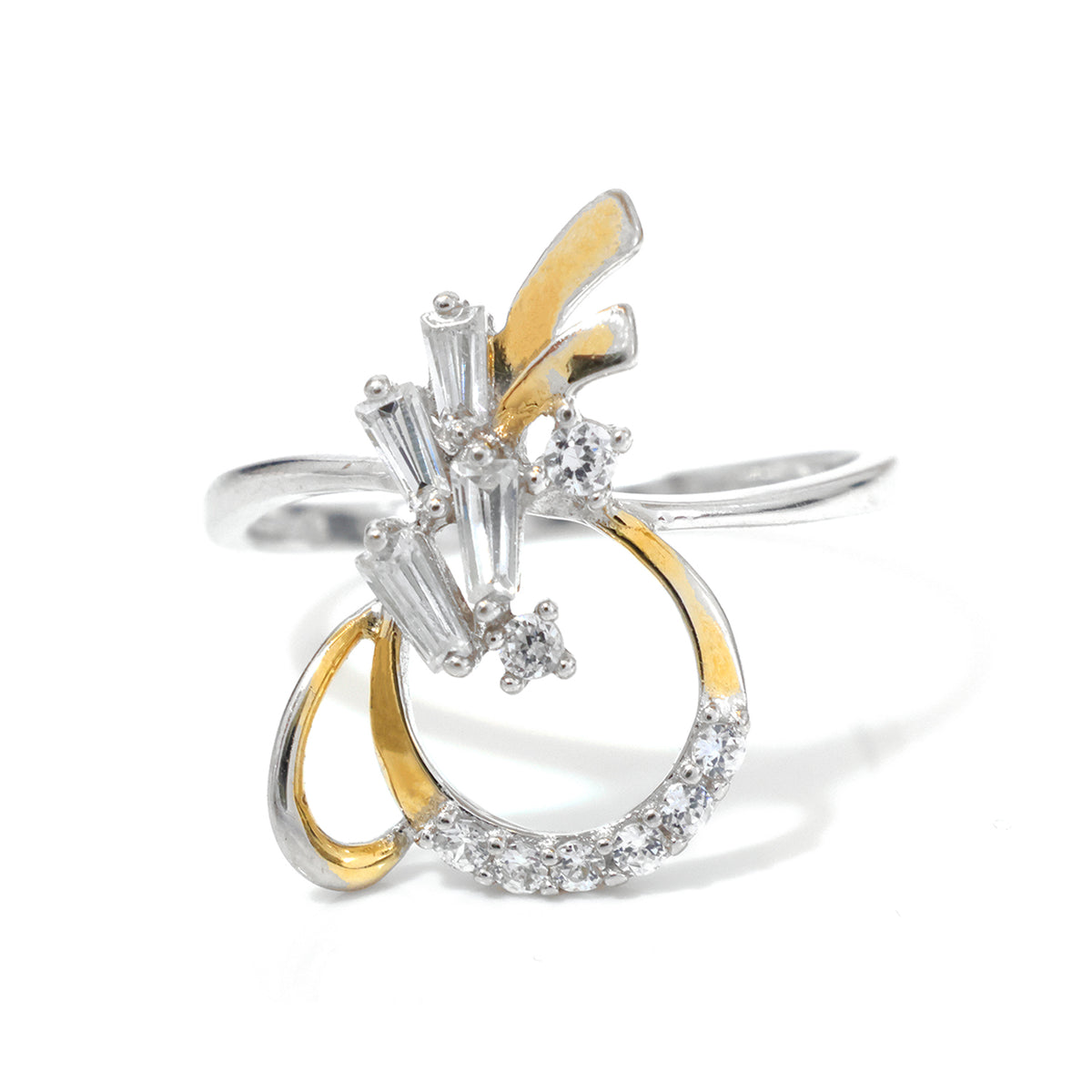 A two-tone silver and yellow gold ring featuring a sculptural, abstract design with baguette and round clear stones, set against a plain white background.