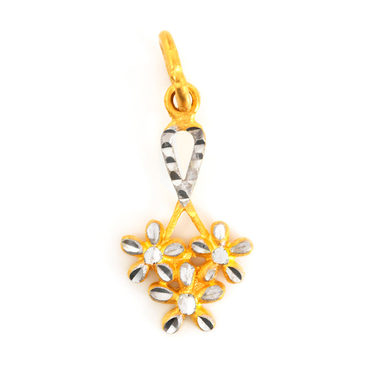 Gold and silver floral pendant on a white background