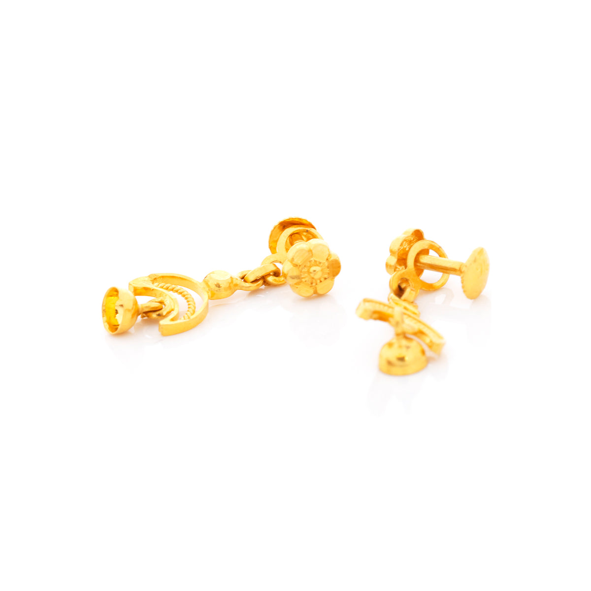 Pair of gold earrings on a white background