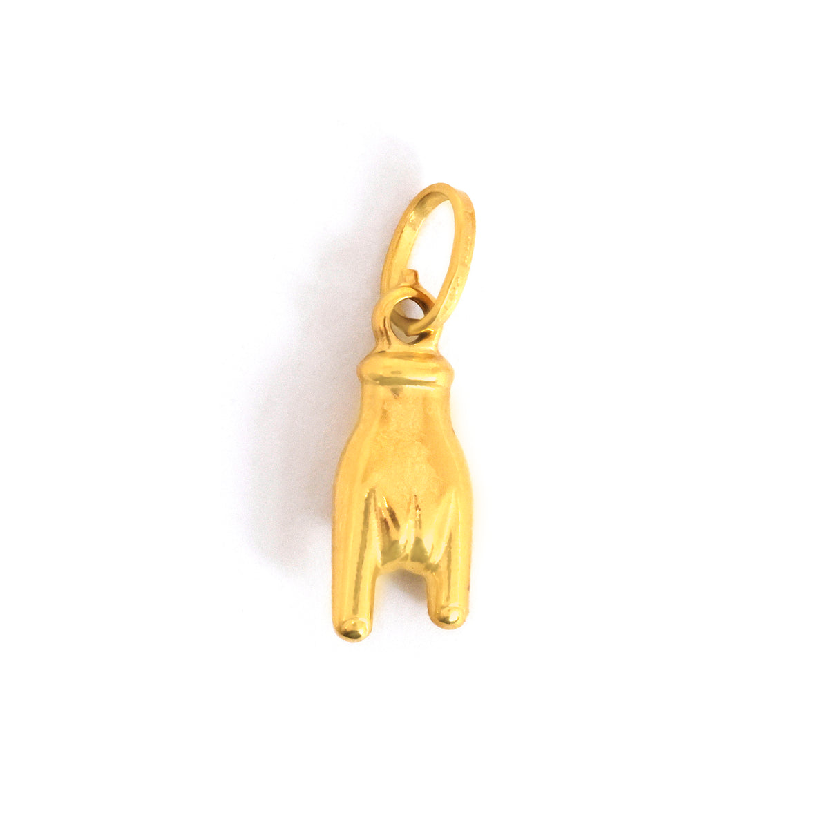 ذهب dog paw charm on white background