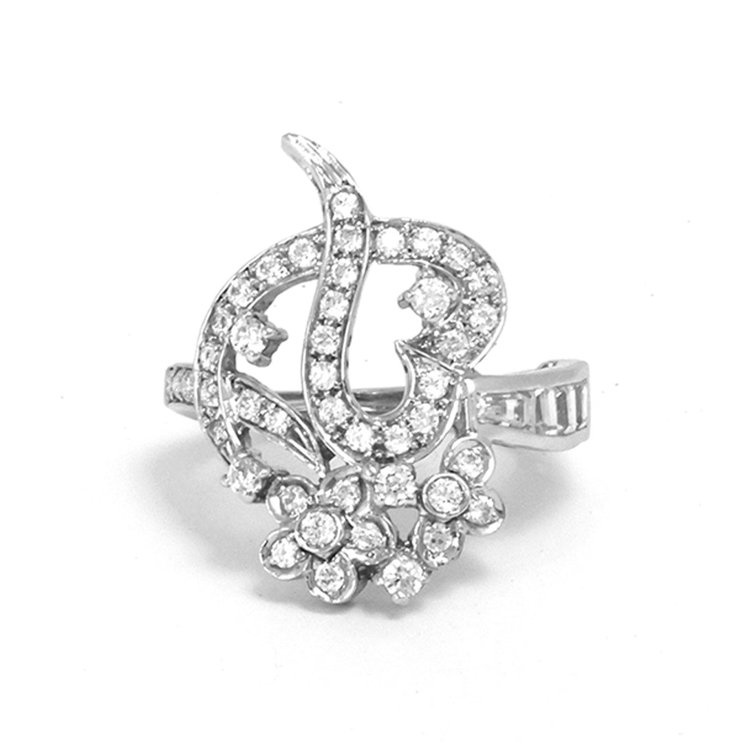 Silver ring with diamond accents on a white background