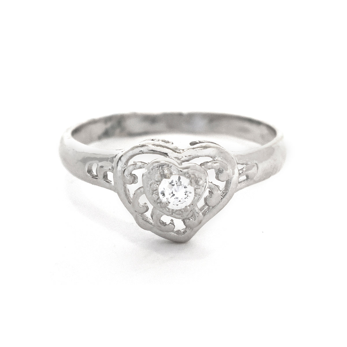 Silver heart-shaped ring with a diamond on a white background