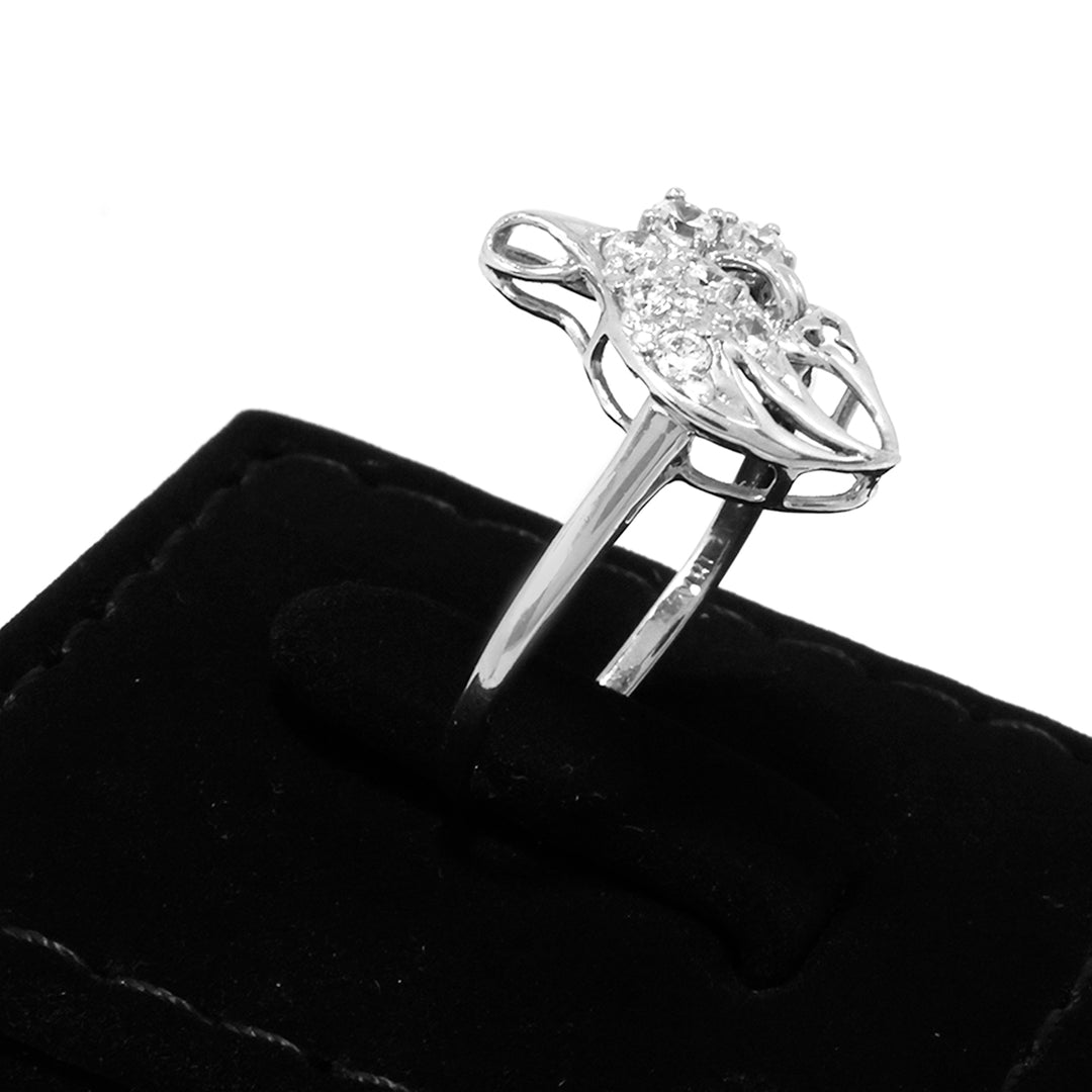 Silver ring with gemstones on a black jewelry box