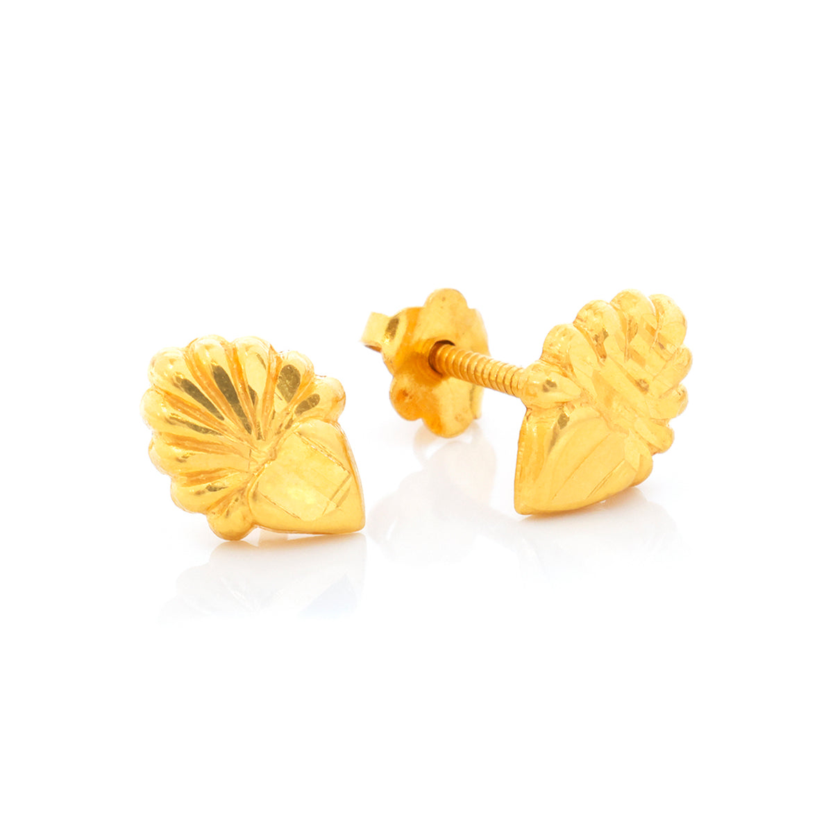Gold shell-shaped stud earrings on a white background
