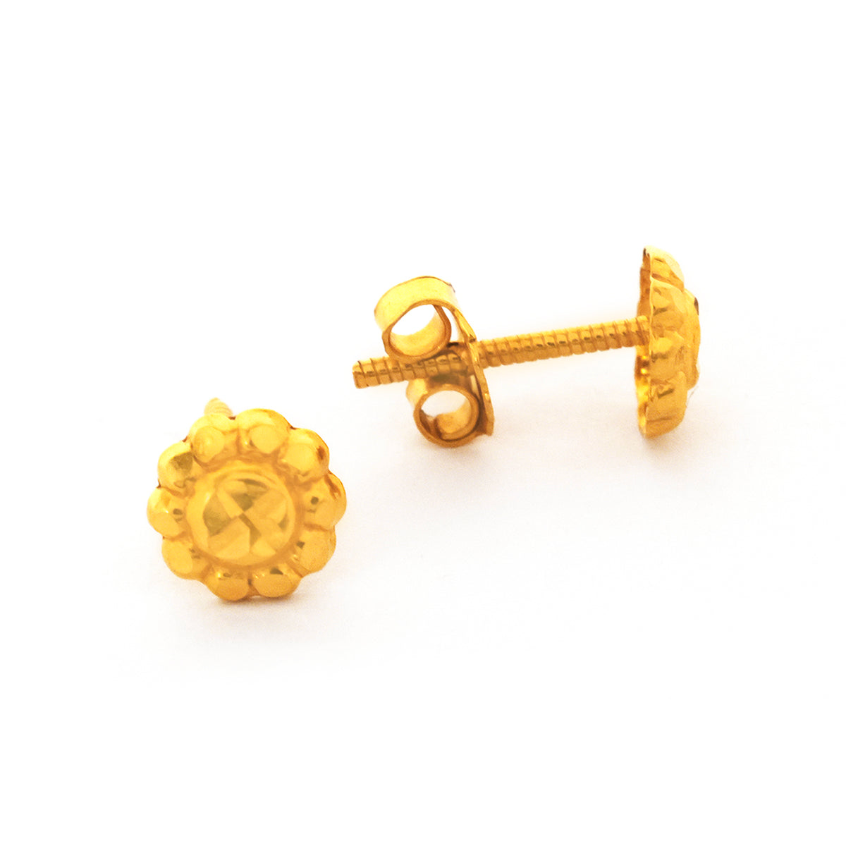 Gold earrings on a white background