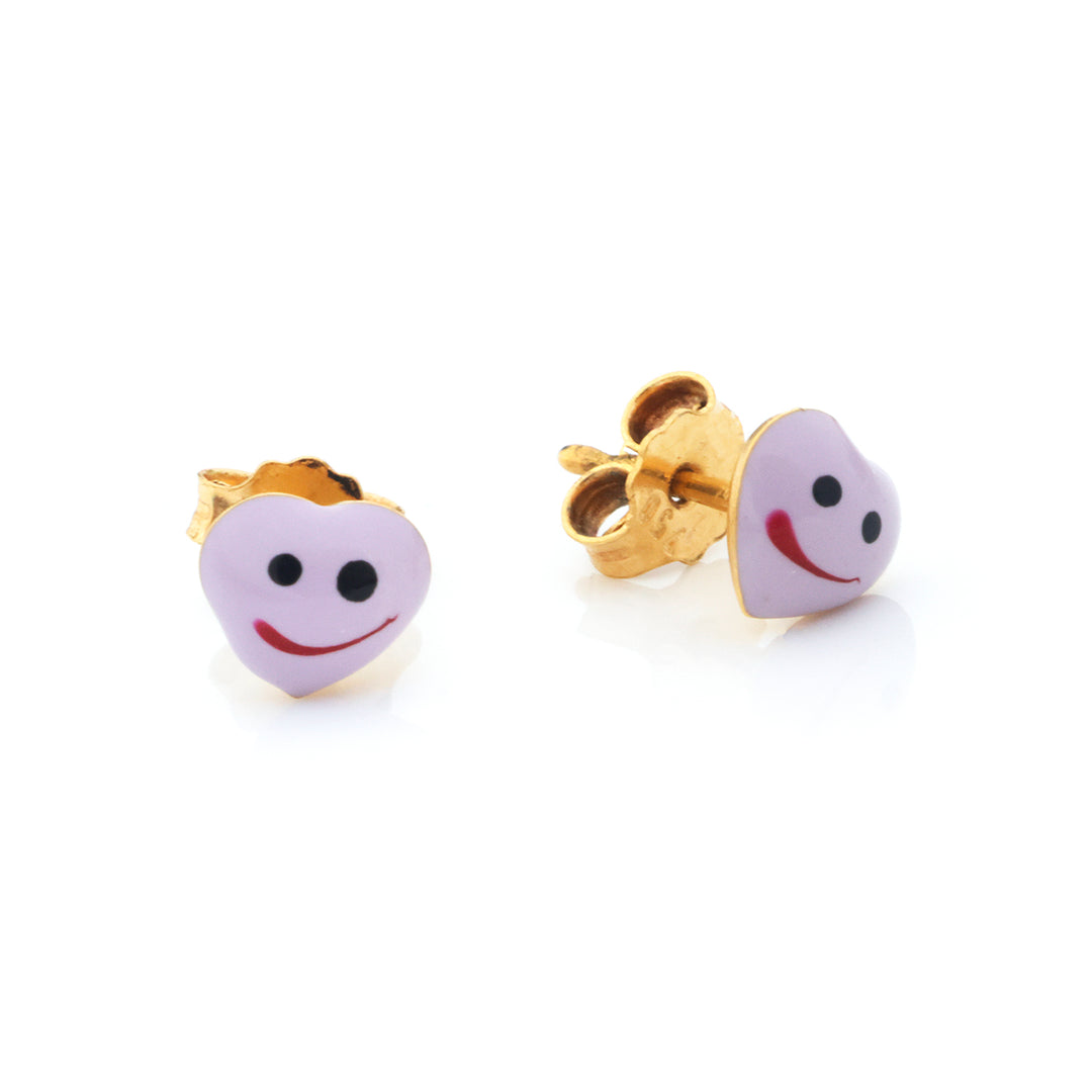 A pair of gold heart-shaped stud earrings with a light purple enamel face featuring black eyes and a red smile, shown on a white background.