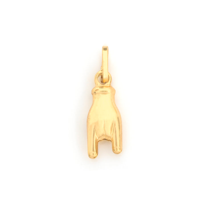 A small gold charm shaped like a hand with the middle finger, shown on a plain white background.