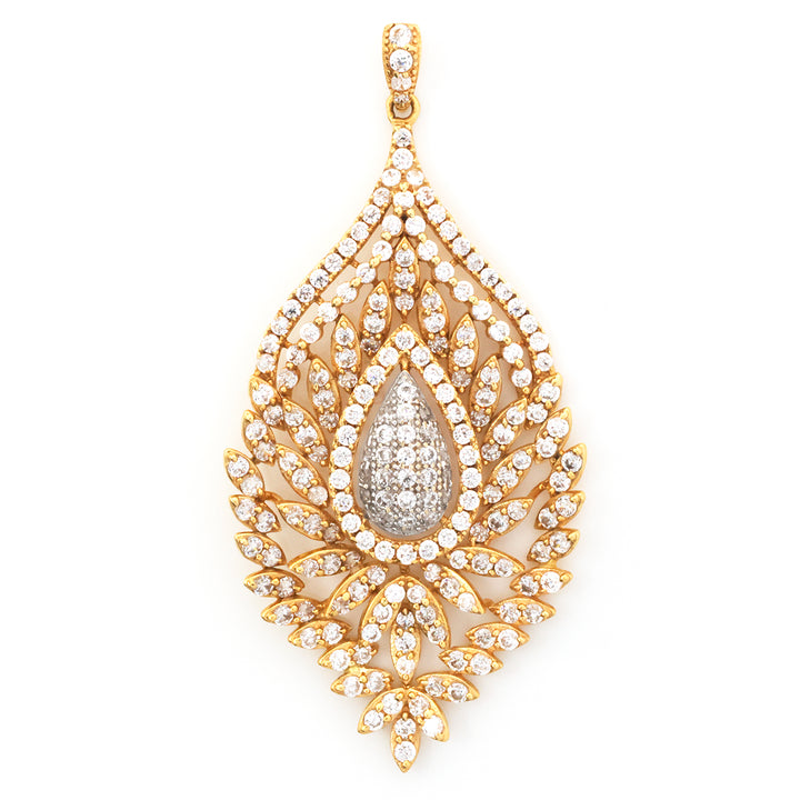 A teardrop-shaped gold pendant adorned with numerous small clear stones and a larger central teardrop cluster of stones, shown on a plain white background.