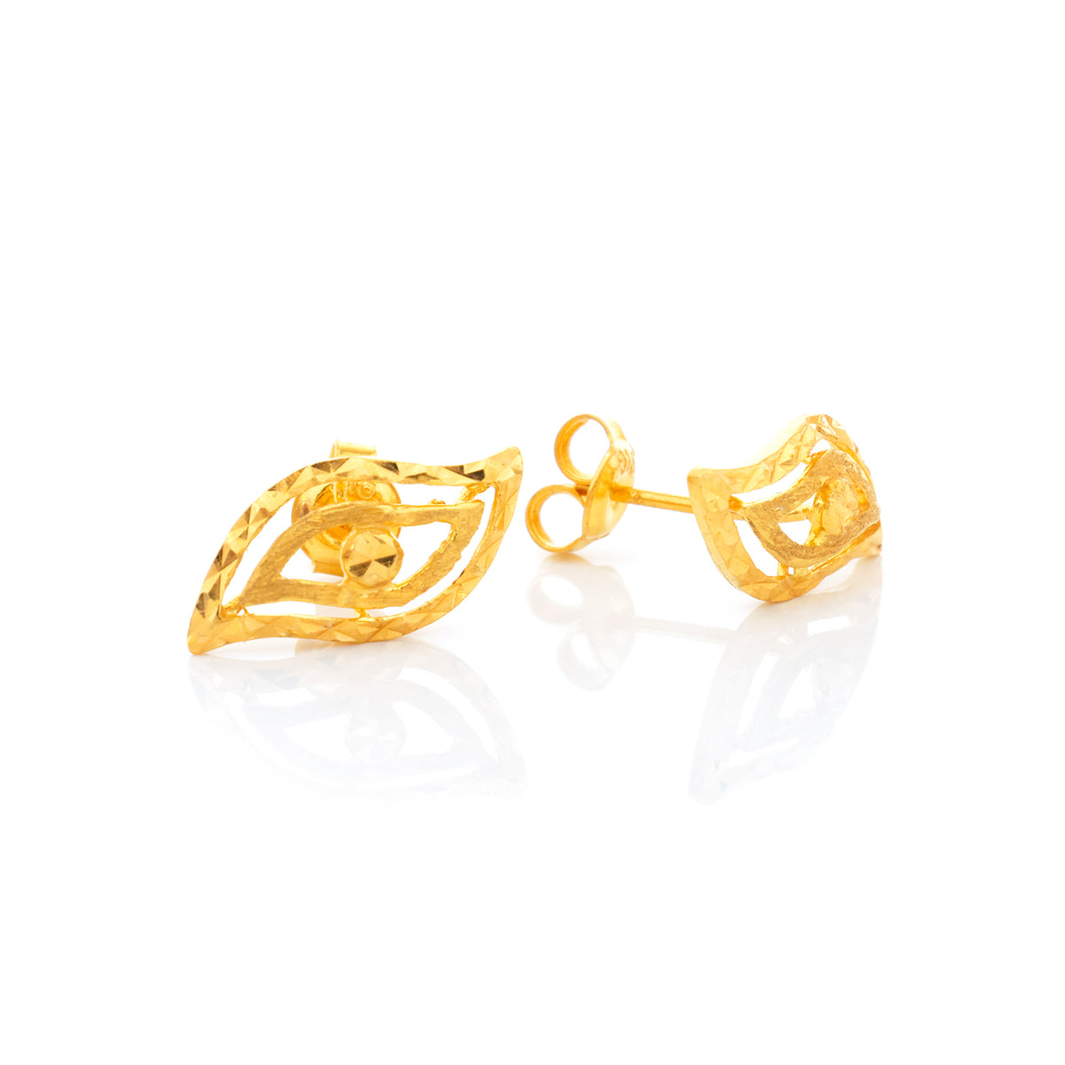 Gold earrings on a white background