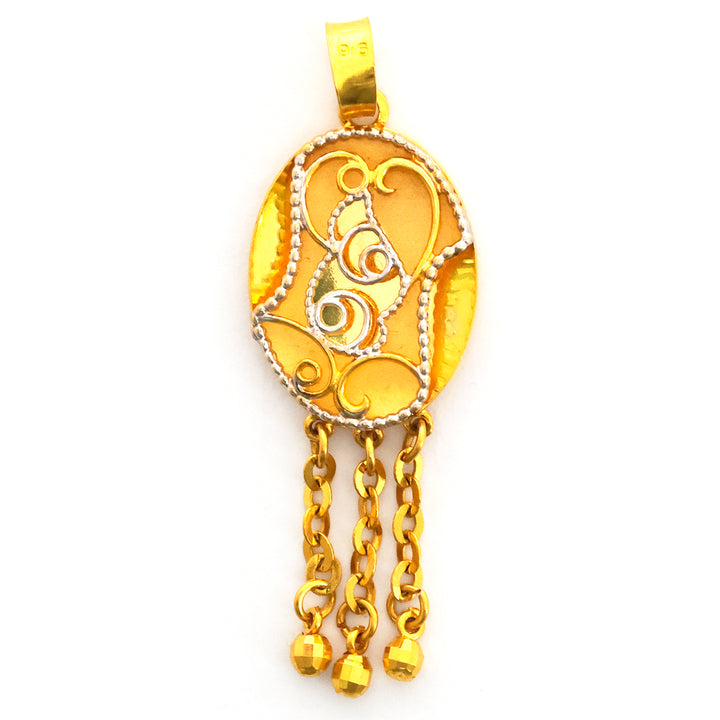 Gold pendant with intricate design and hanging chains on a white background