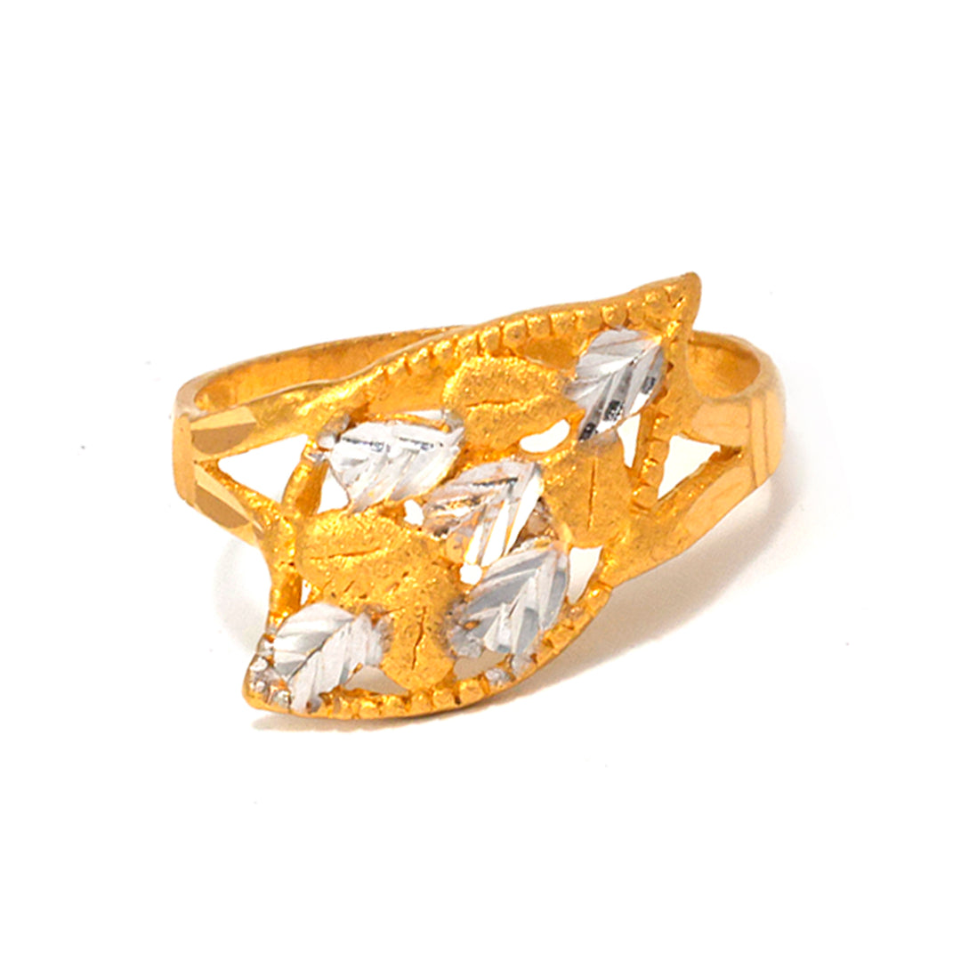 Gold ring with clear gemstones on a white background