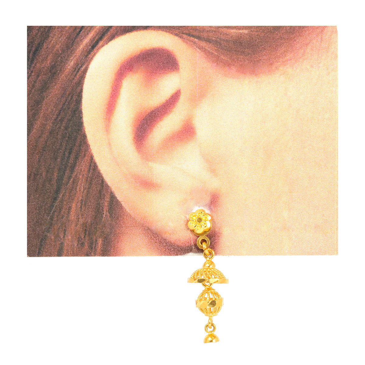 Pair of gold earrings on a white background