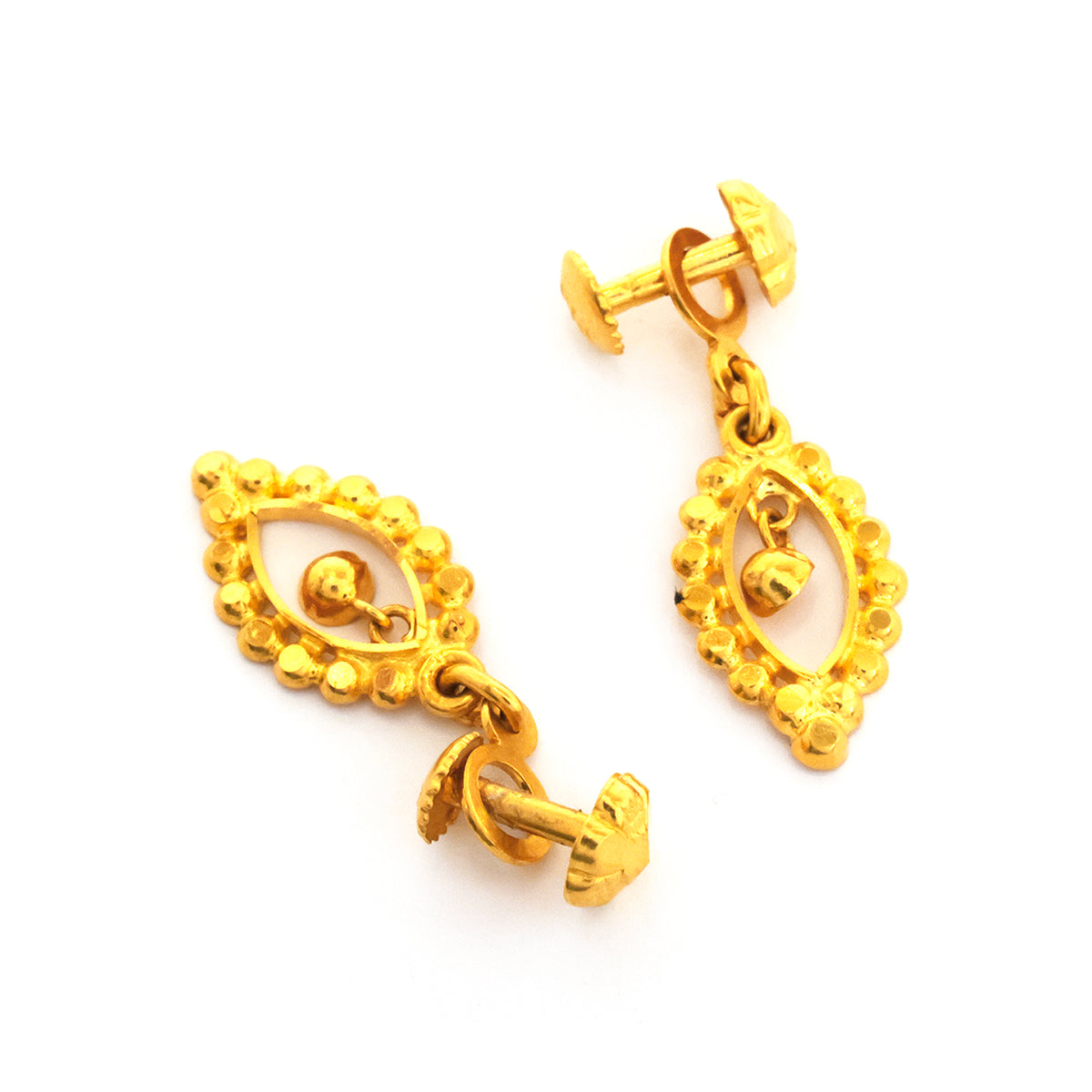 Pair of gold earrings on a white background