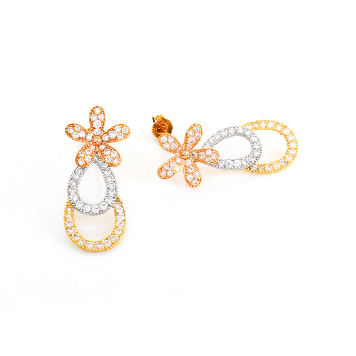 Pair of gold and silver earrings on a white background