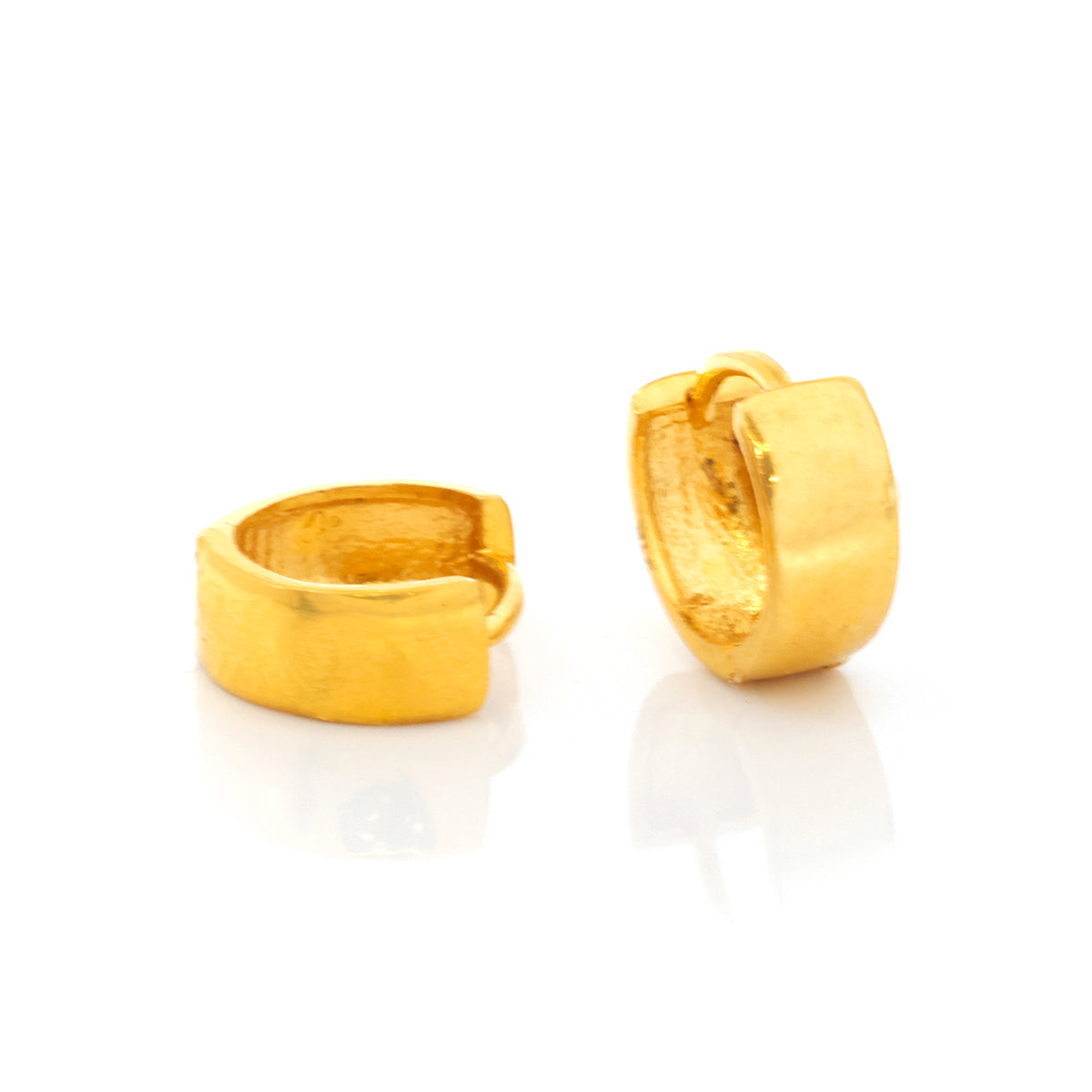 Pair of gold hoop earrings on a white background