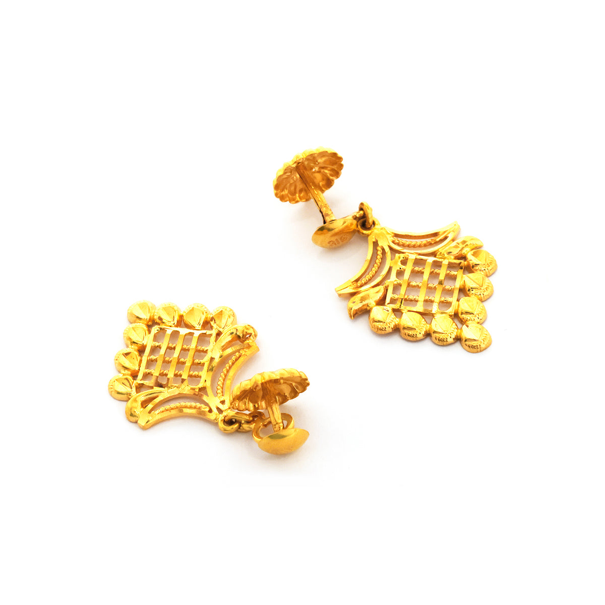 Pair of gold earrings on a white background