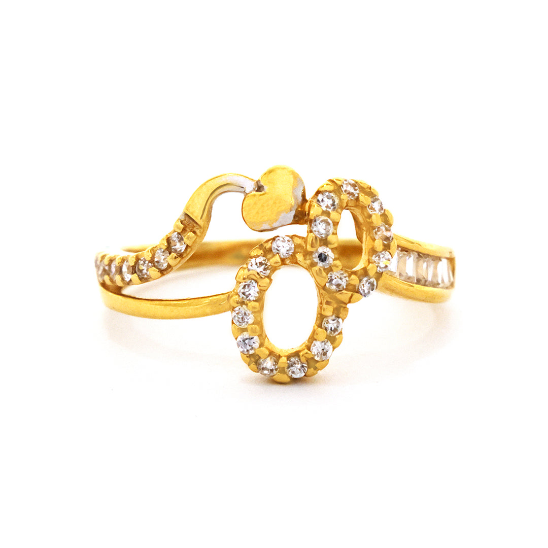 Gold ring with diamond accents on a white background