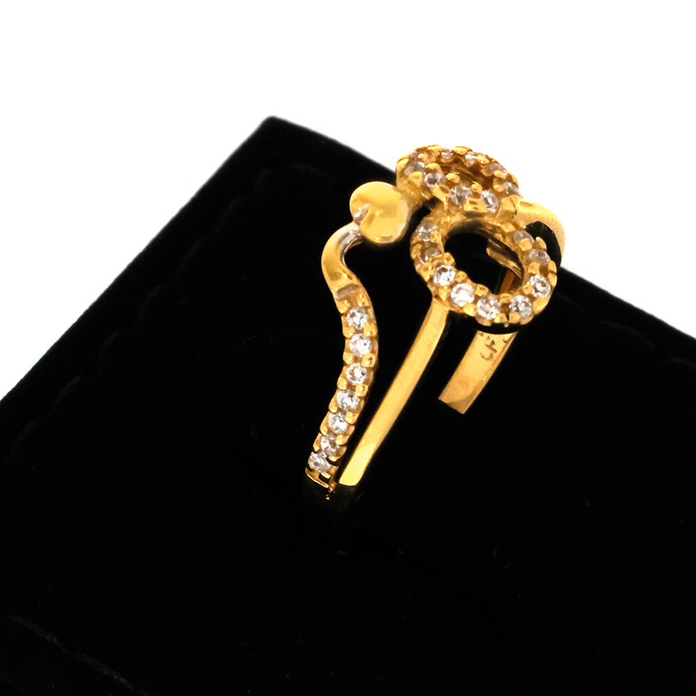 Gold earring with clear stones on a black background