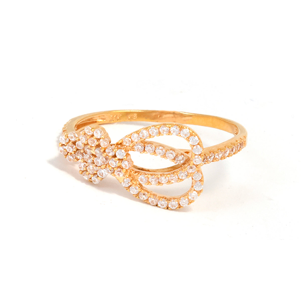 Gold bracelet with pearl accents on a white background