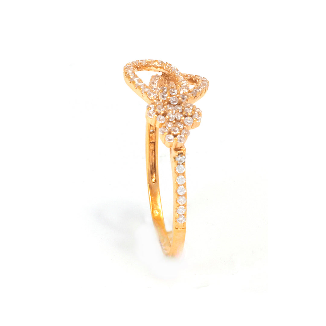 Gold butterfly ring with gemstones on a white background