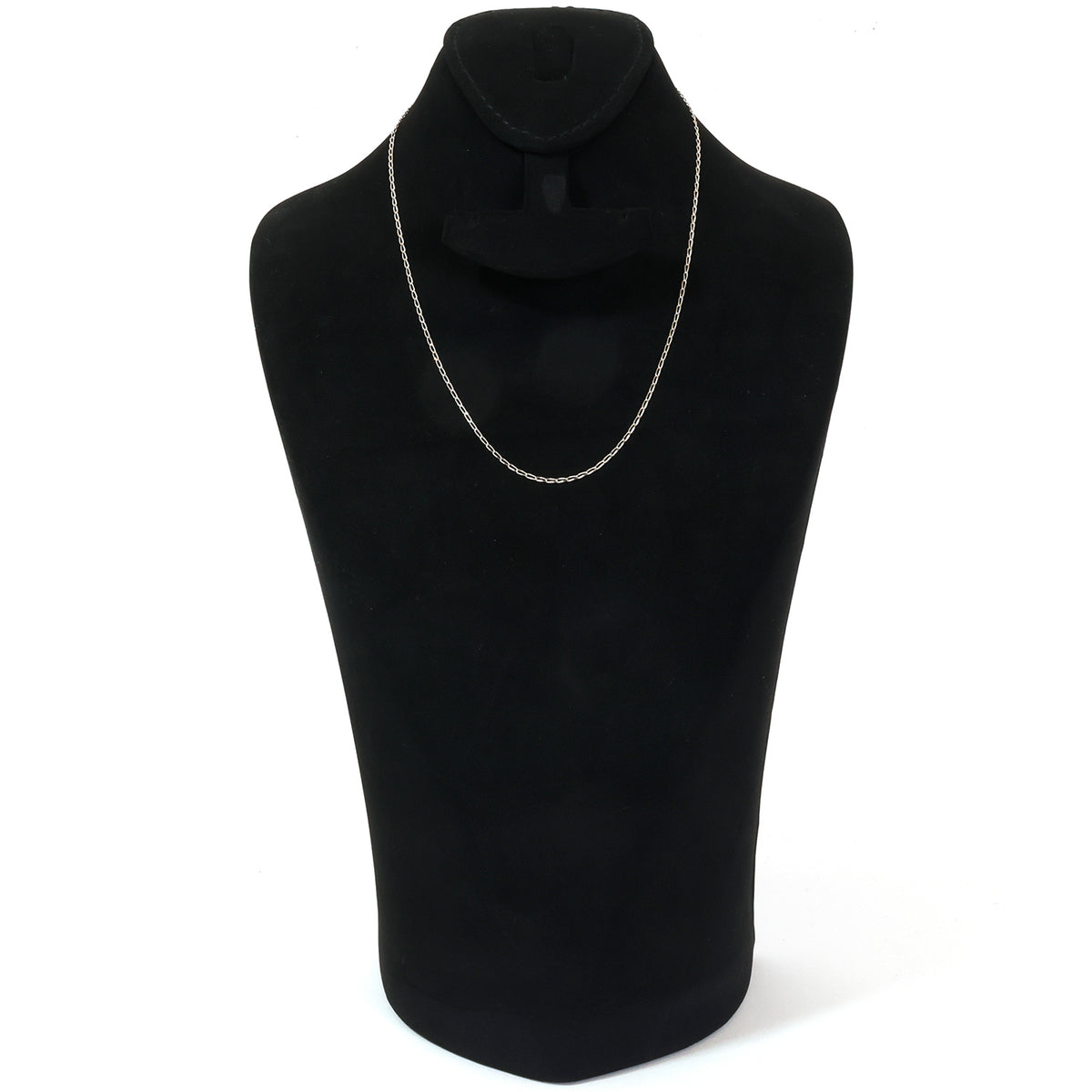 Silver necklace on a black mannequin bust against a white background
