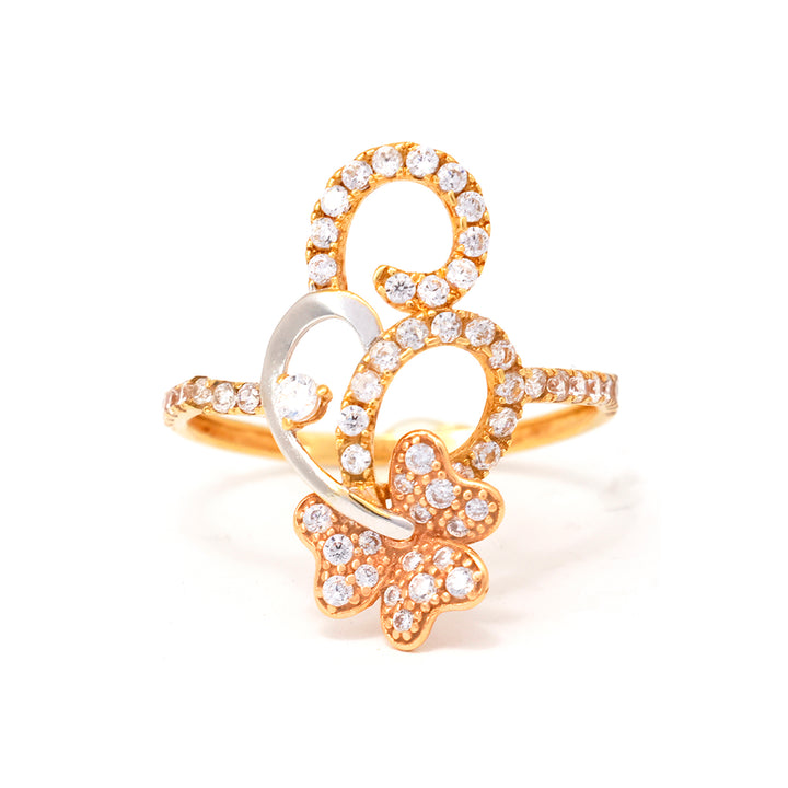 Gold and silver ring with diamond accents on a white background