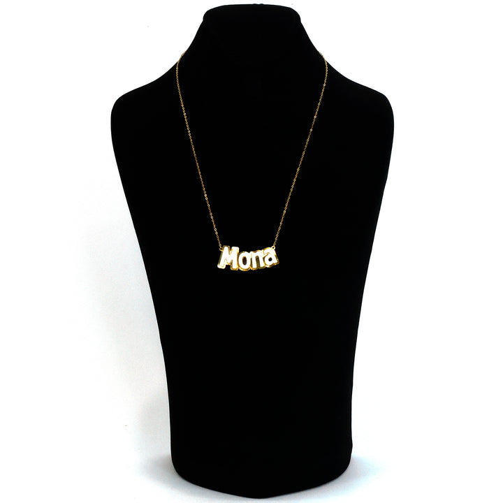Gold necklace with 'Mona' pendant on a black mannequin bust.