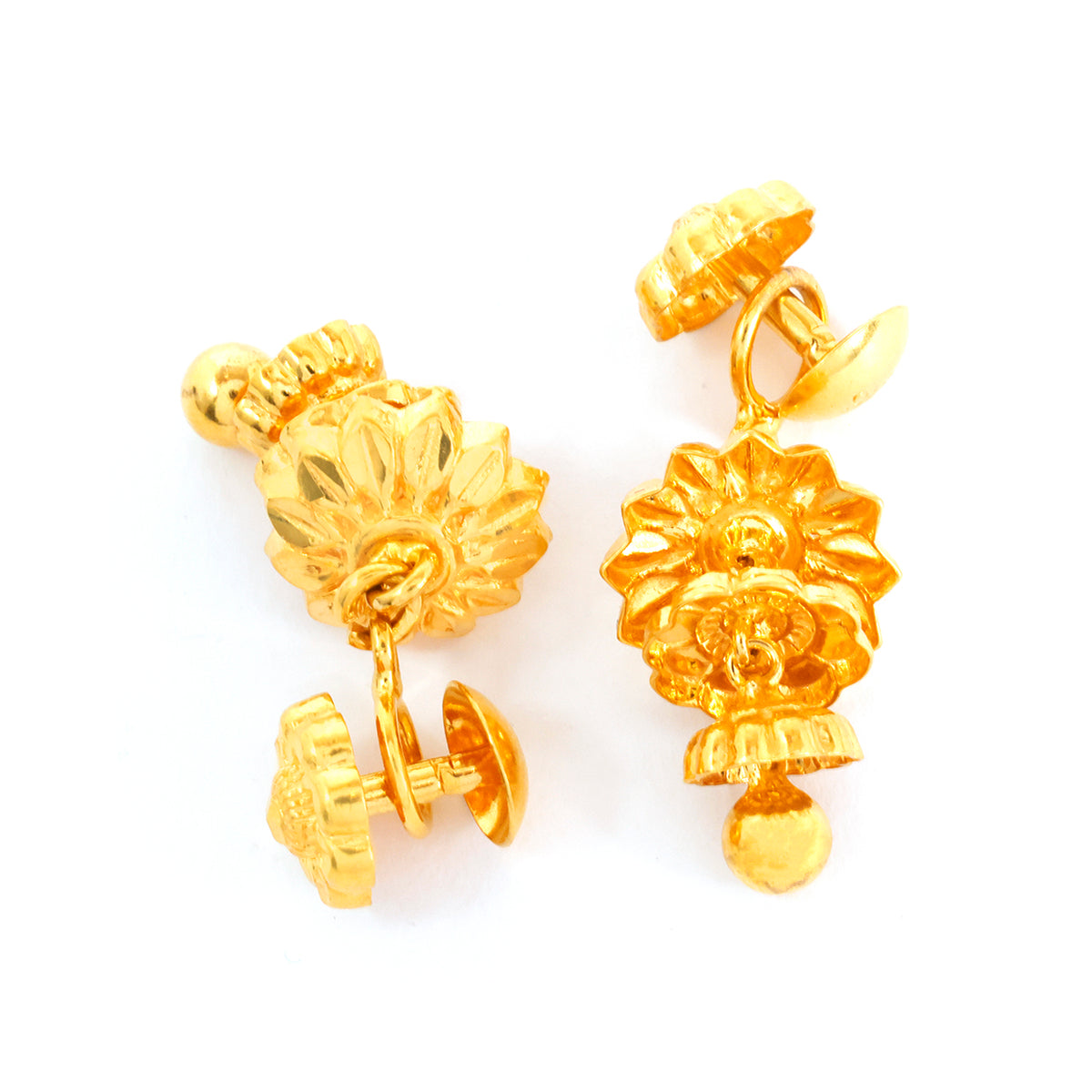 Pair of gold earrings on a white background