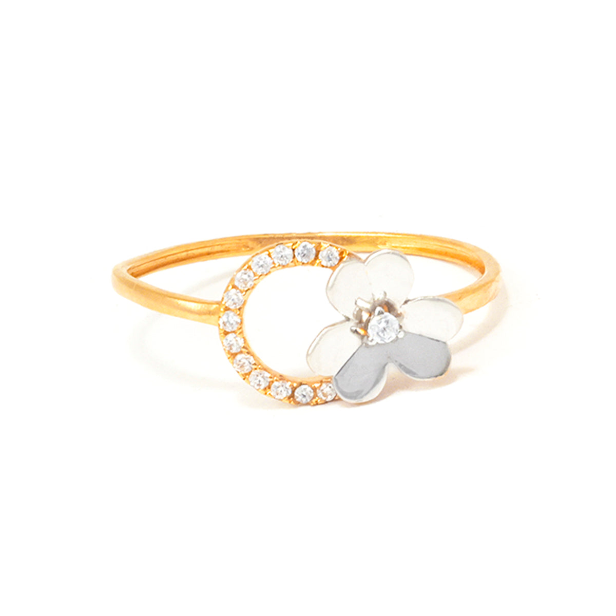 Gold ring with a white flower and small gray bow on a white background