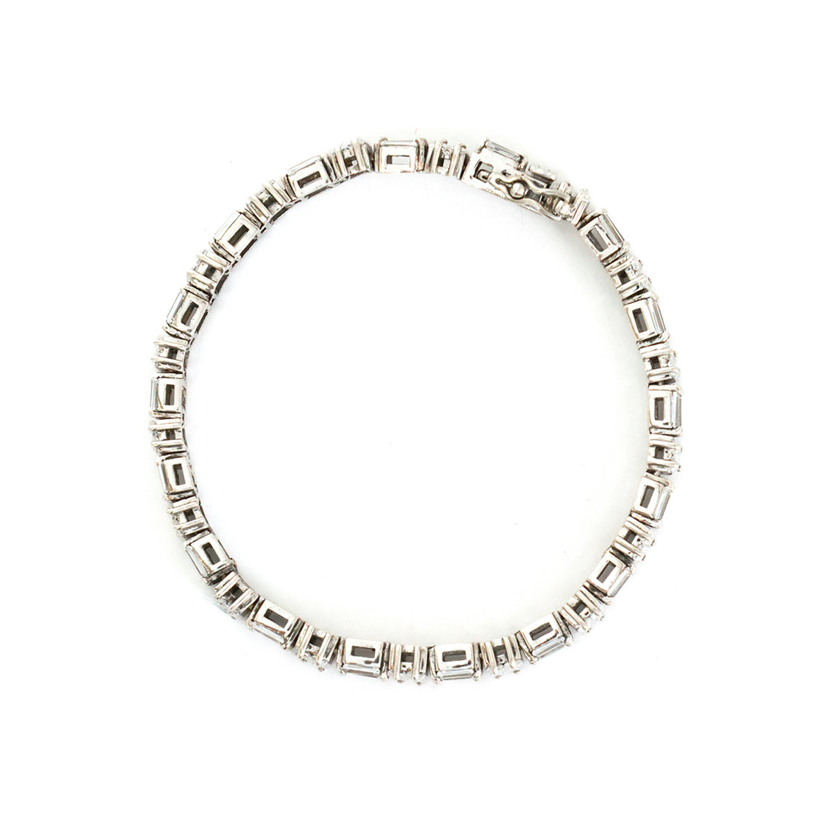 Silver bracelet with square beads on a white background