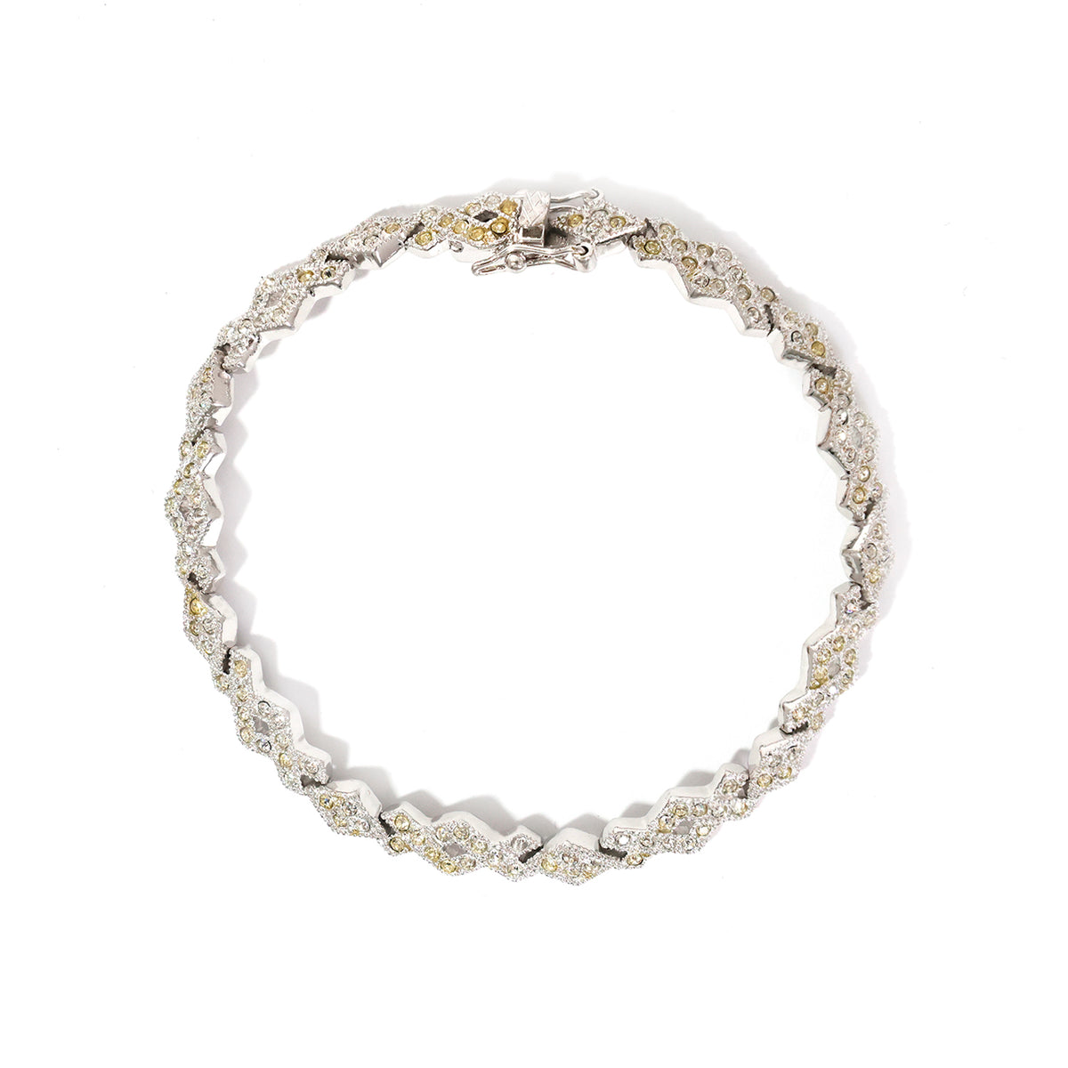 Silver bracelet with clear stones on a white background