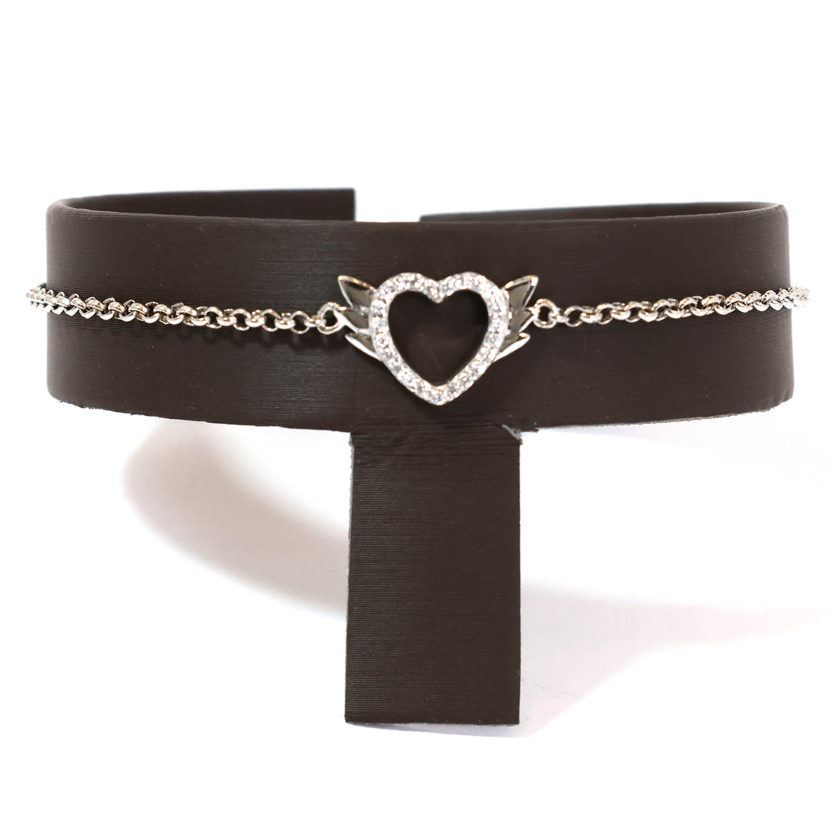 Black leather choker with a silver heart-shaped pendant on a white background