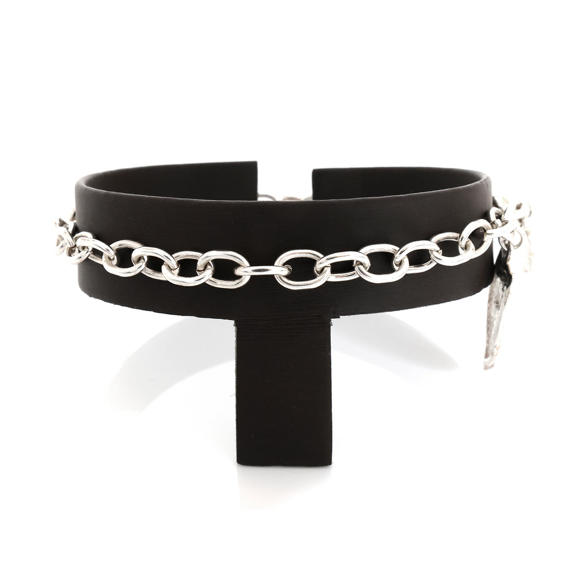 Black choker with silver chain and pendant on a white background