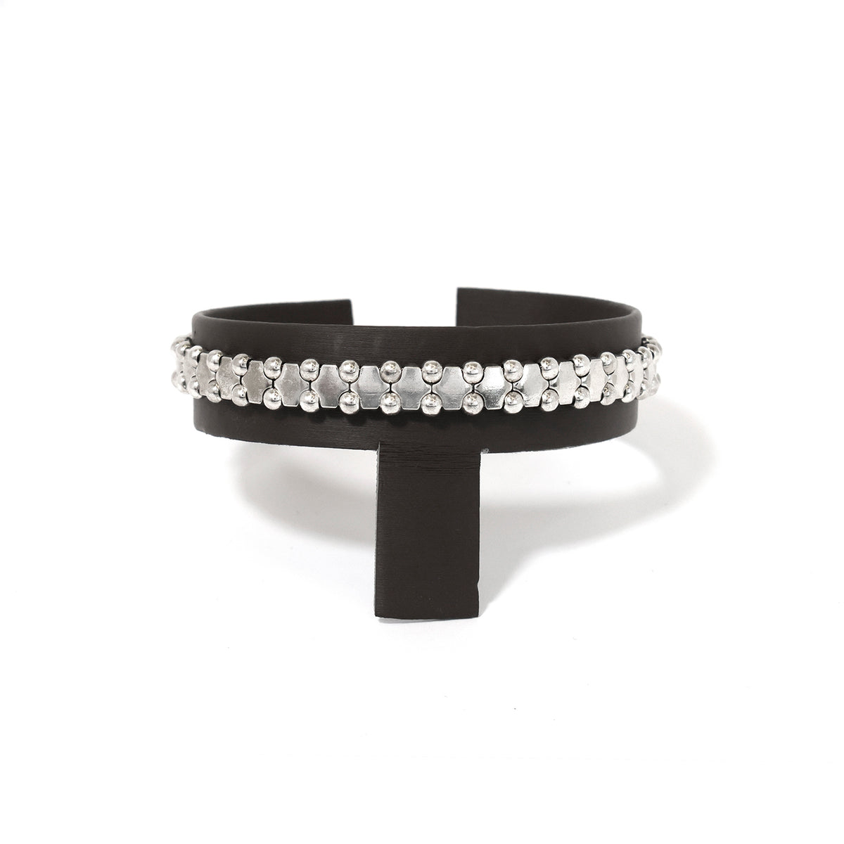 Black high-heeled sandal with pearl embellishments on a white background