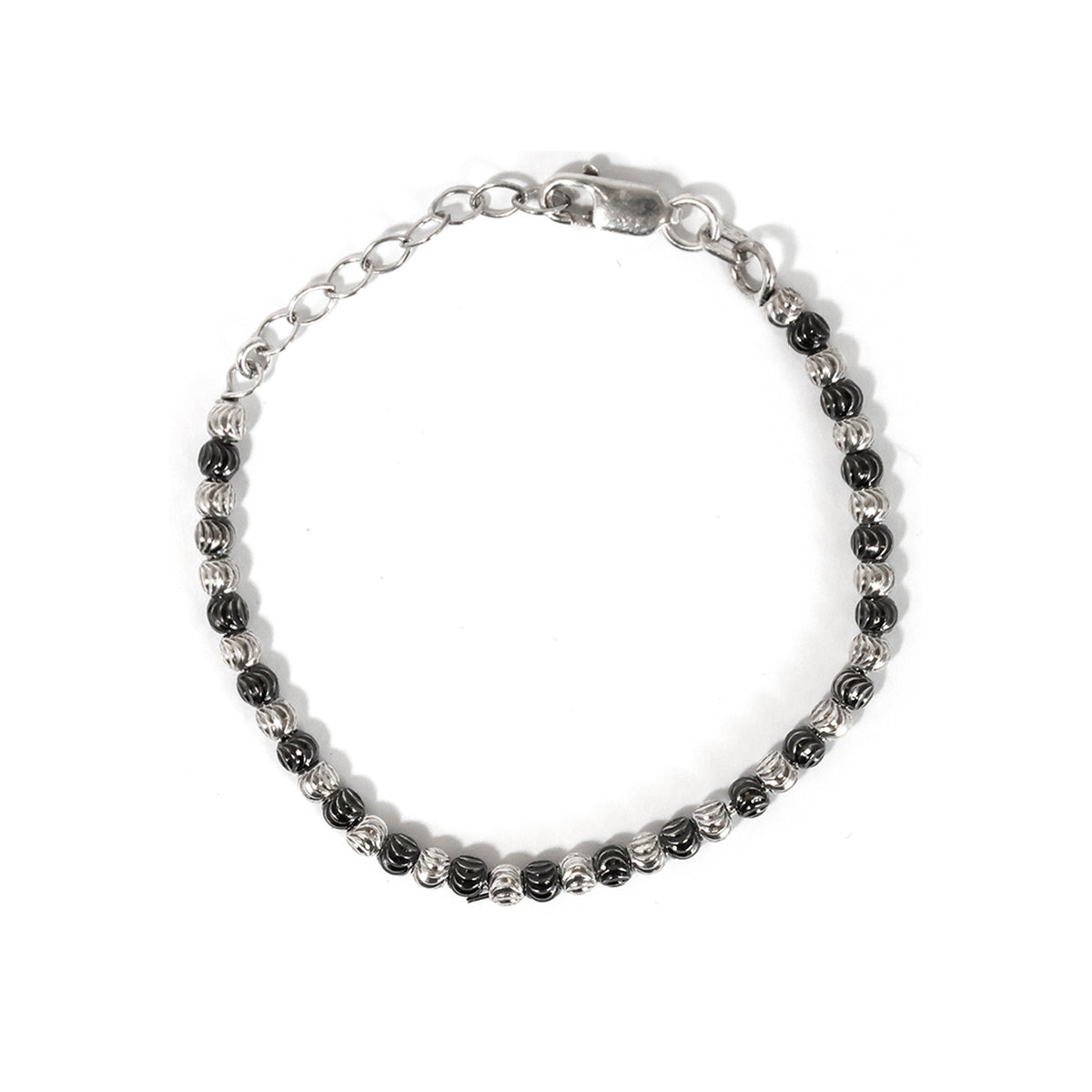 Silver bracelet with black beads on a white background