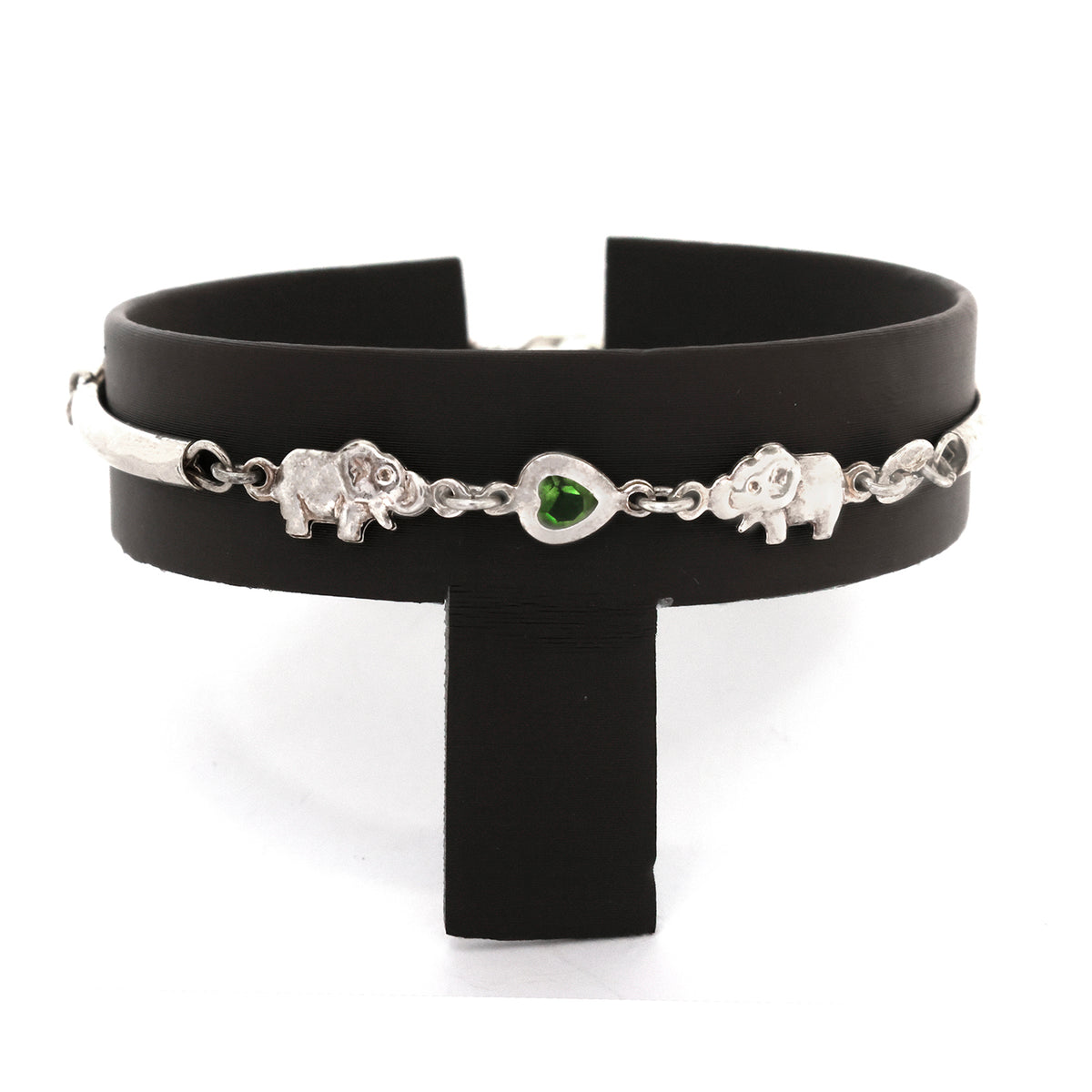 Black choker with silver chain and green gemstone on a white background