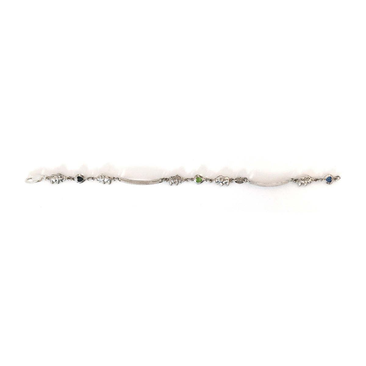 Delicate silver bracelet with small gemstones on a white background
