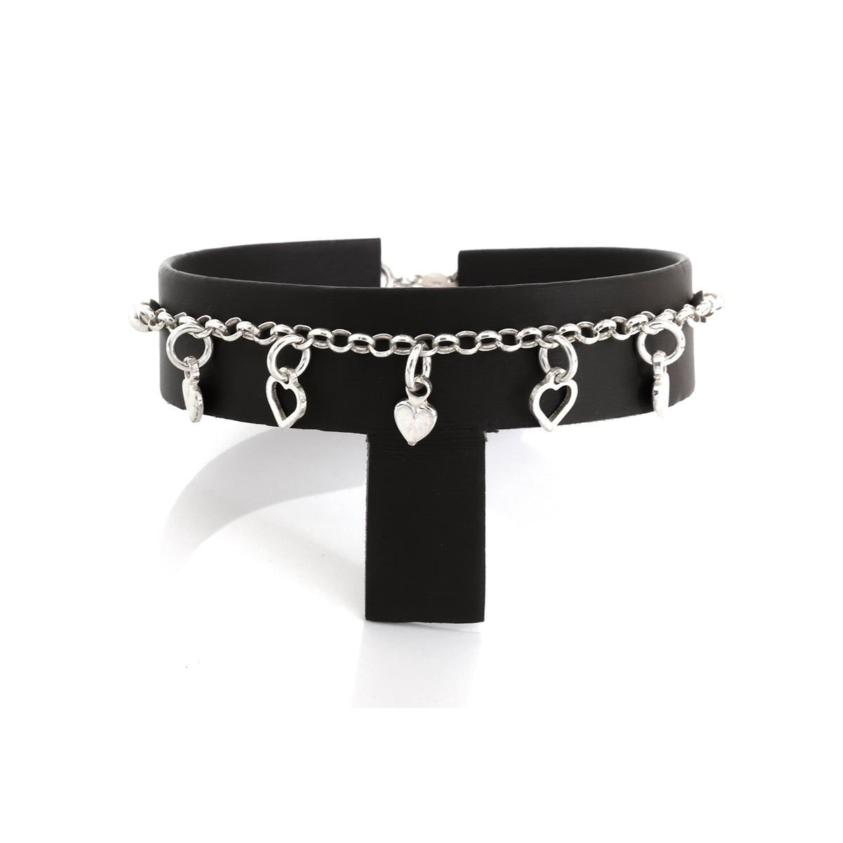 Black choker with silver chain and heart-shaped charms on a white background