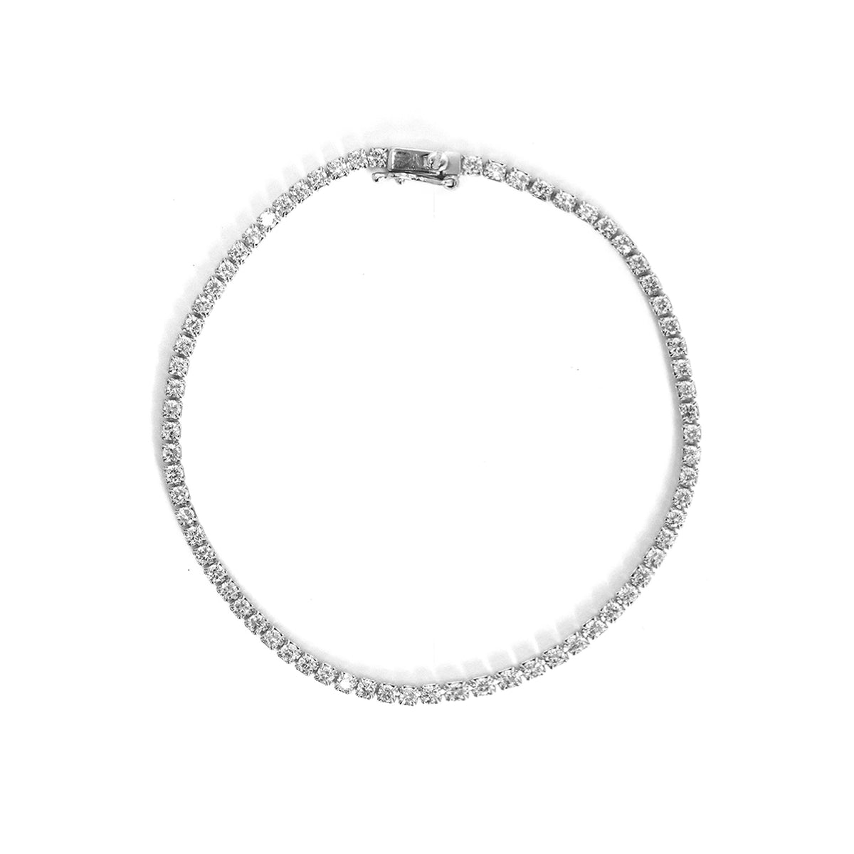Silver bracelet with clear stones on a white background