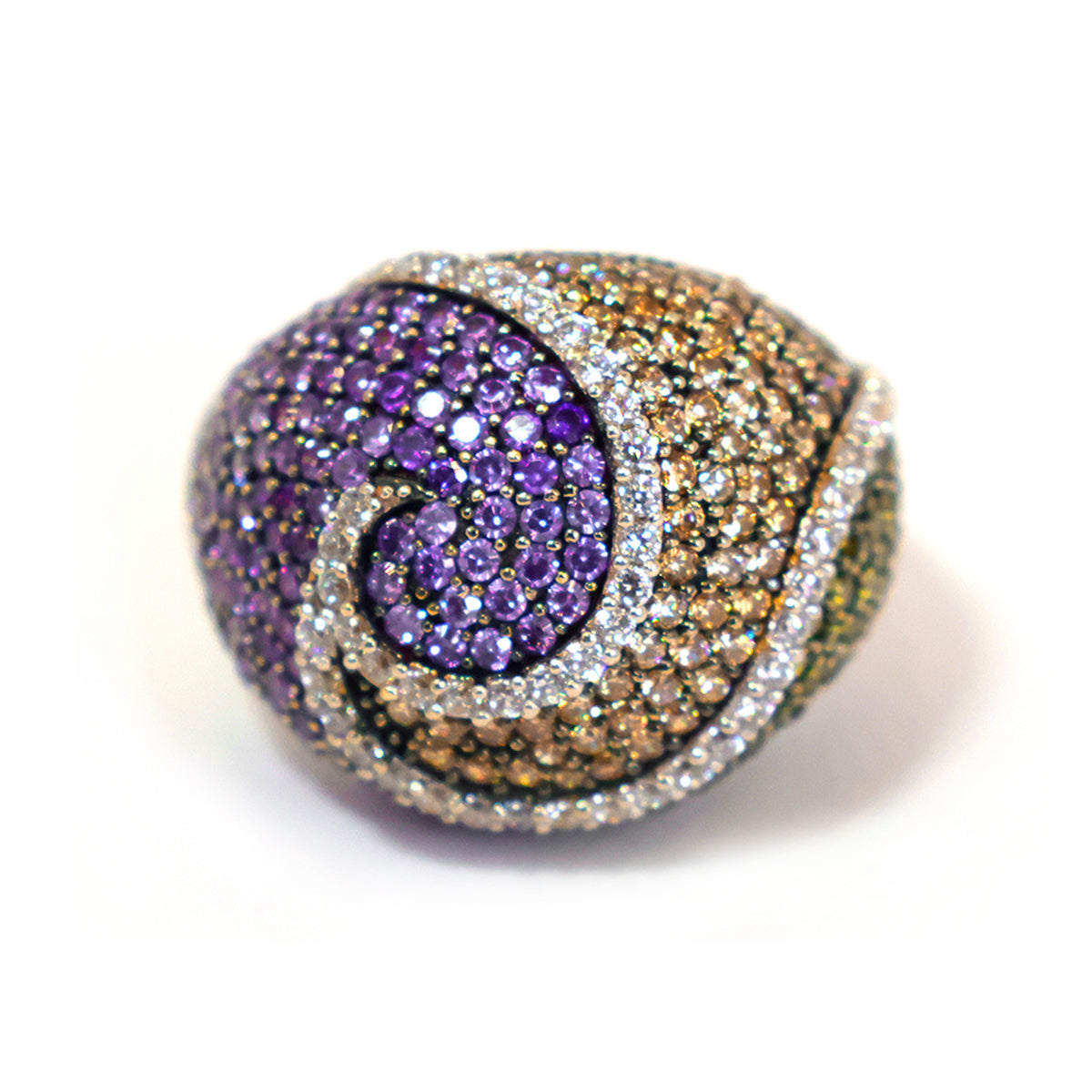 Ring with purple gemstone and gold accents on a white background
