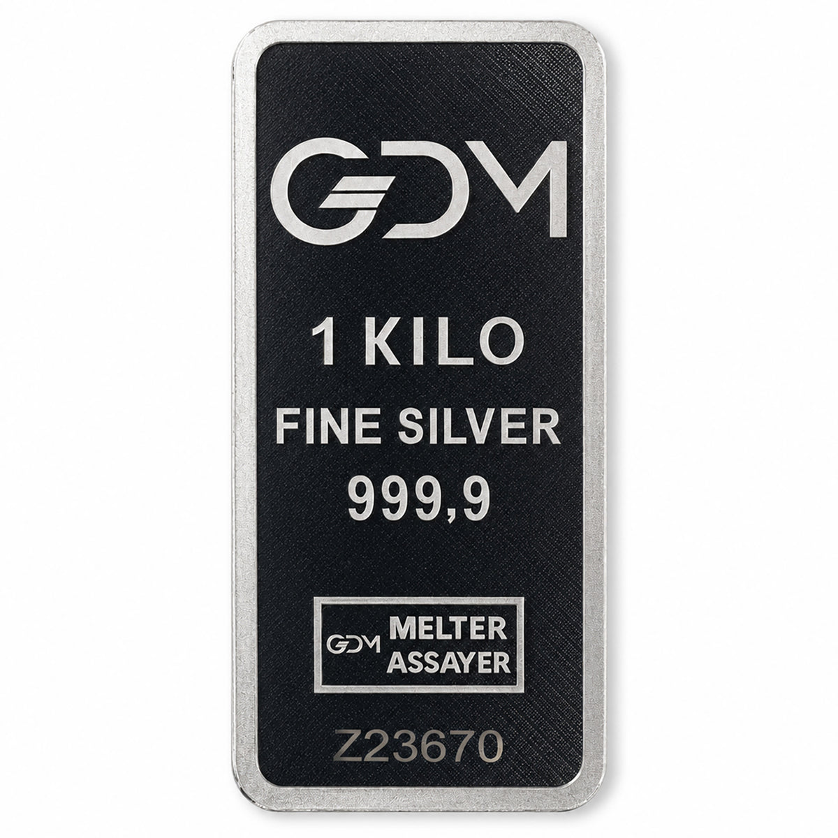A rectangular silver bar with a black textured face, featuring the GDM logo and text indicating '1 KILO FINE SILVER 999,9 MELTER ASSAYER'.