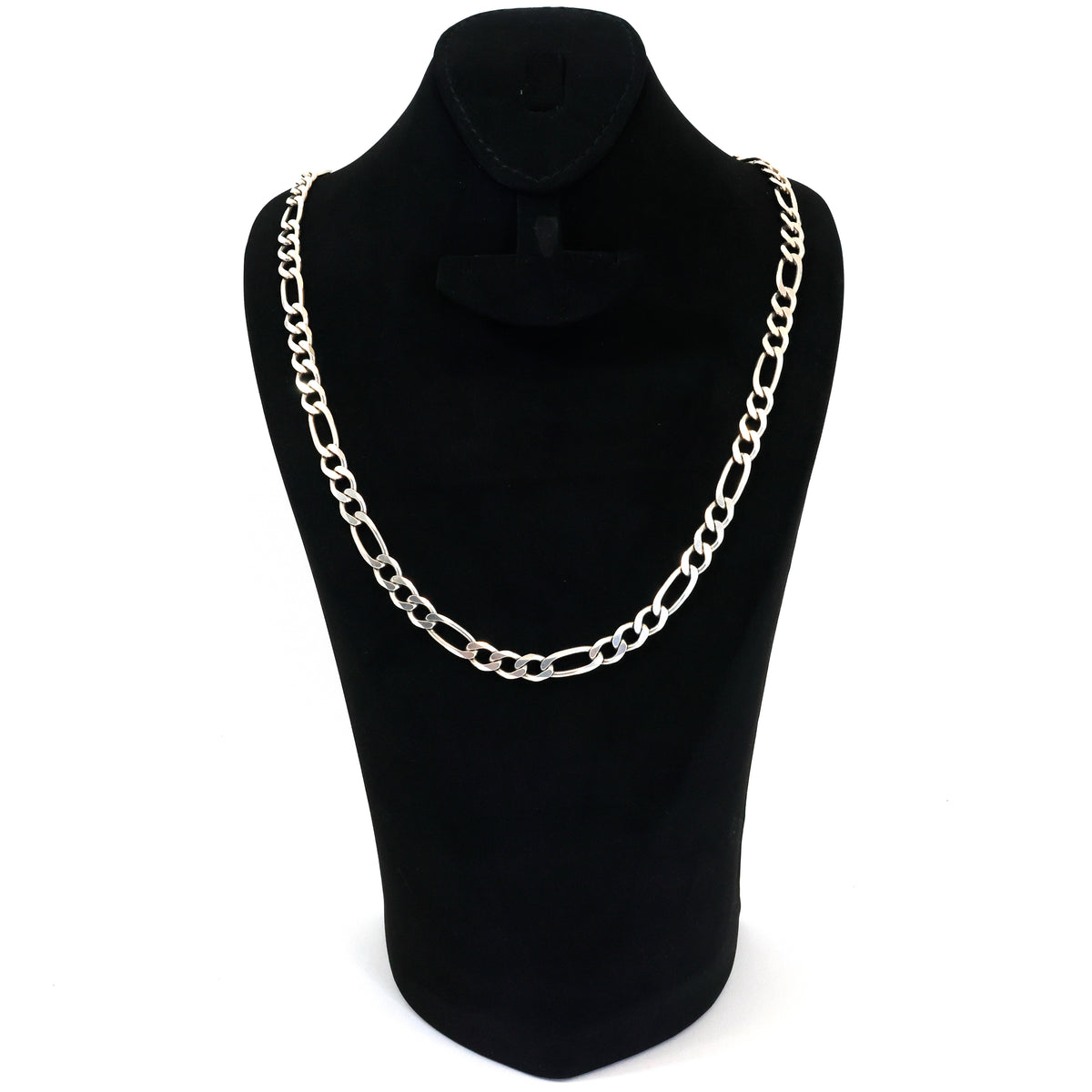 Silver chain necklace on a black mannequin bust against a white background